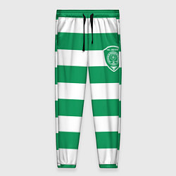 Женские брюки ФК Ахмат на фоне бело зеленой формы